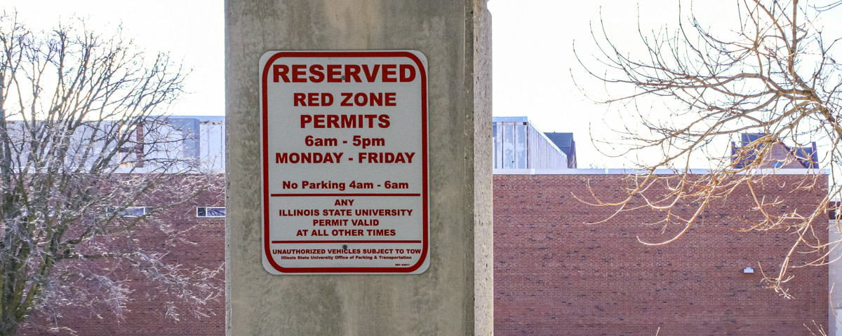 Photo of red Reserved parking sign.