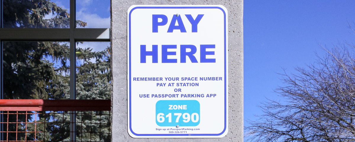 Photo of Paid Visitor parking sign.